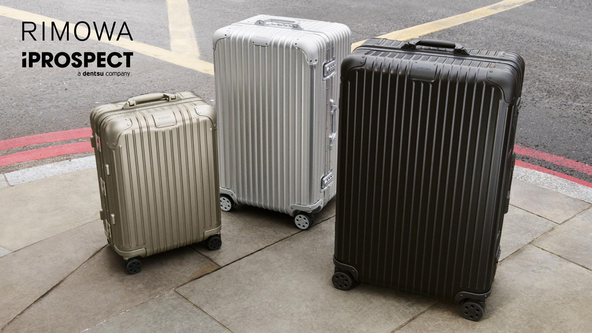Image shows a trio of suitcases. Logos of Rimowa and iProspect a dentsu company are pictured at the top left corner of the image