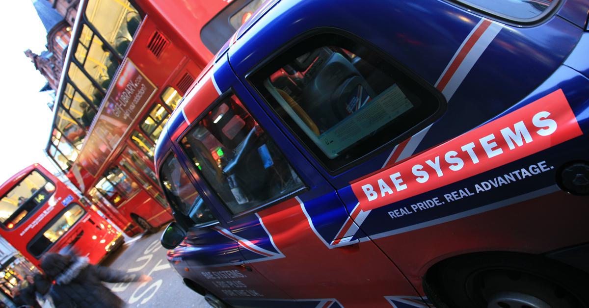 Car in London with the Union Jack printed on it