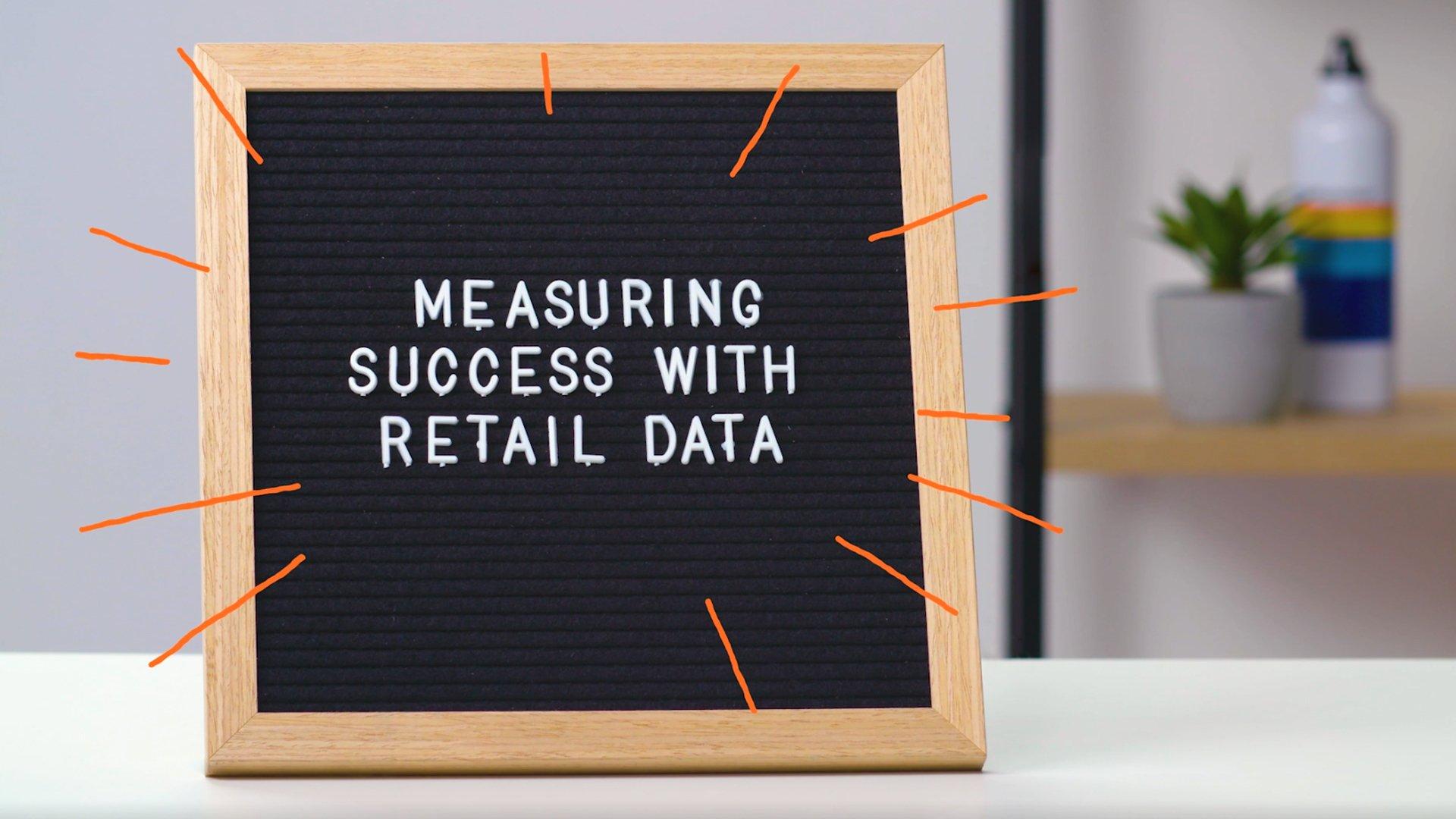 Bulletin board with text that says "Measuring Success with Retail Data"