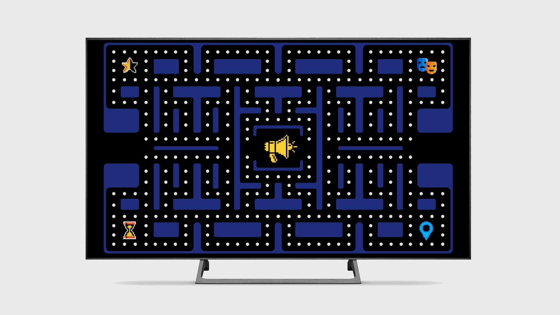 Pacman like game on a TV with a megaphone in the middle of the maze