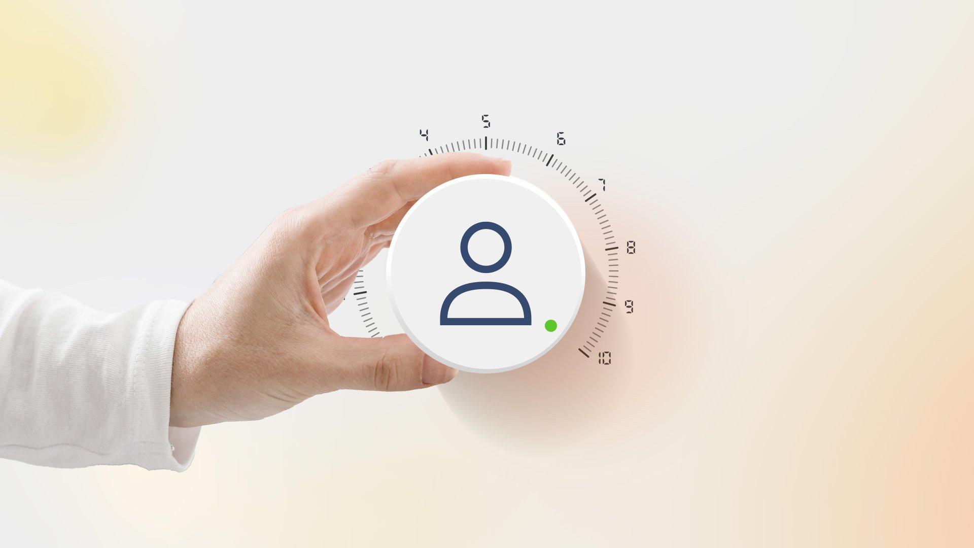 Graphic shows hand holding a thermostat, that has a person icon and green dot, set to 10