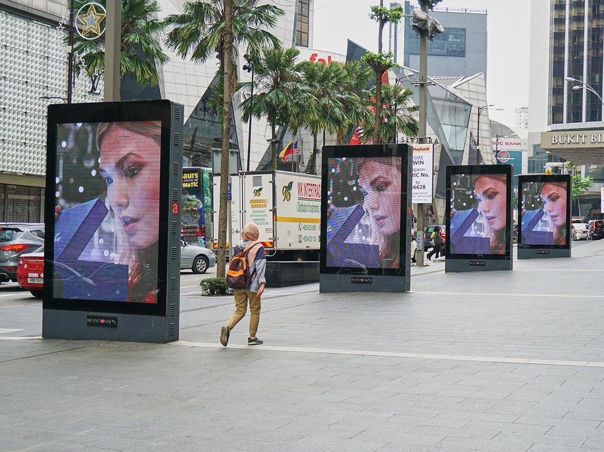 Digital billboards on walking path