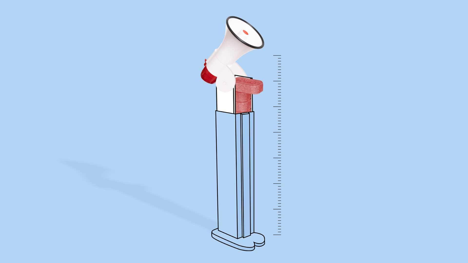 A red pill dispenser topped with a blow horn stands beside measuring lines.